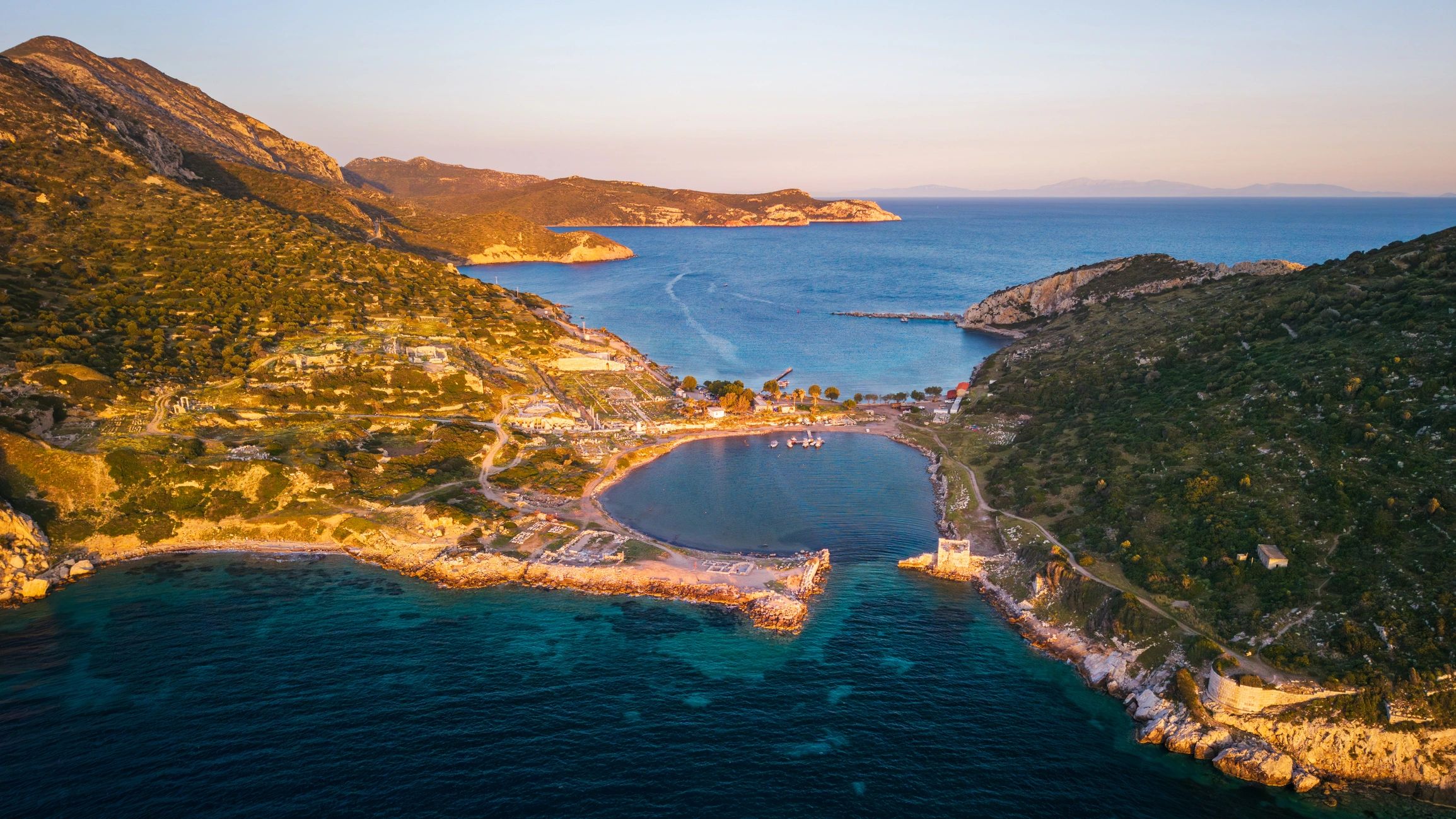 Aerial view of ancient coastal harbor and ruins