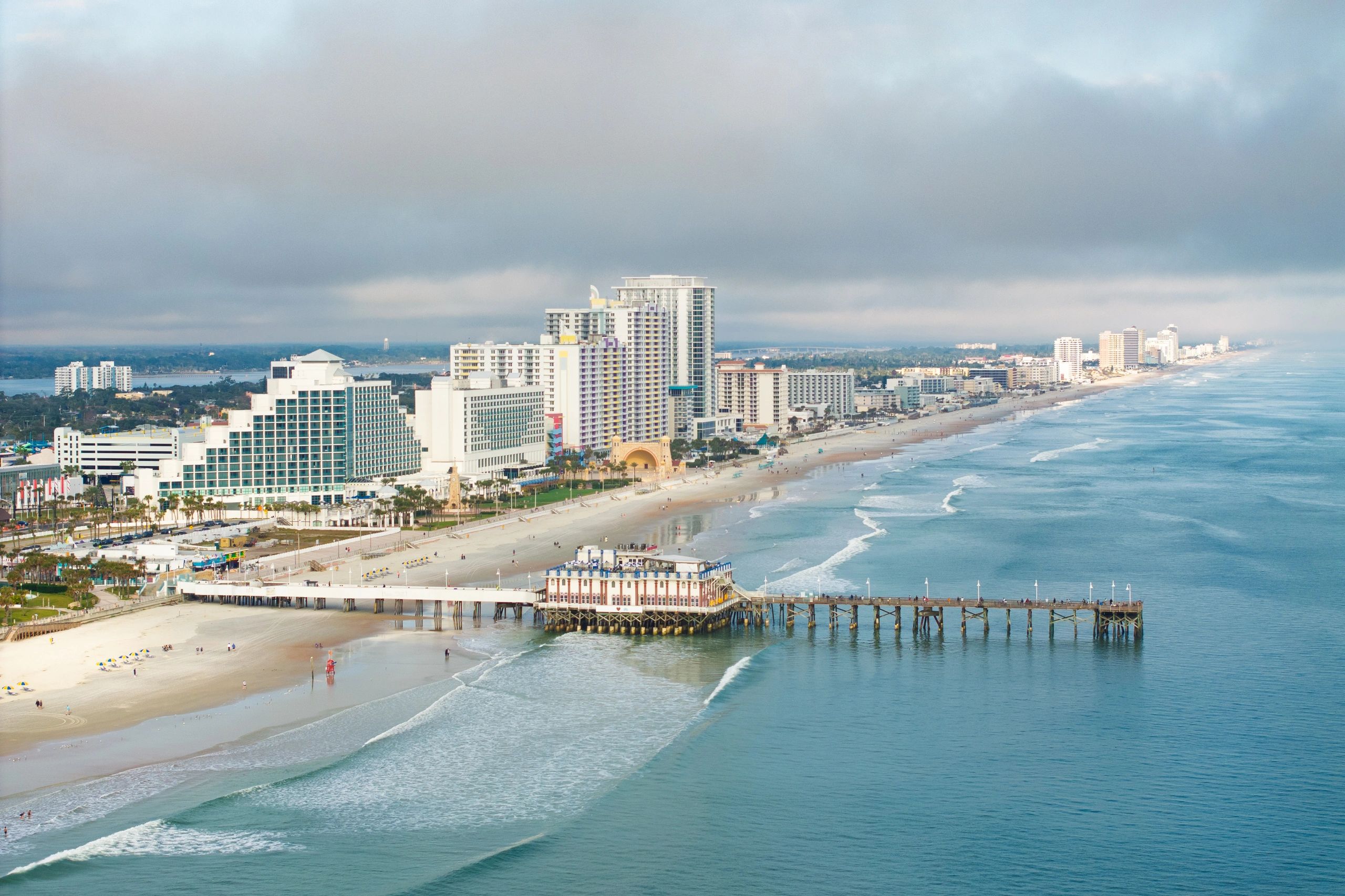 Aerial view of Daytona Beach shoreline with hotels and pier