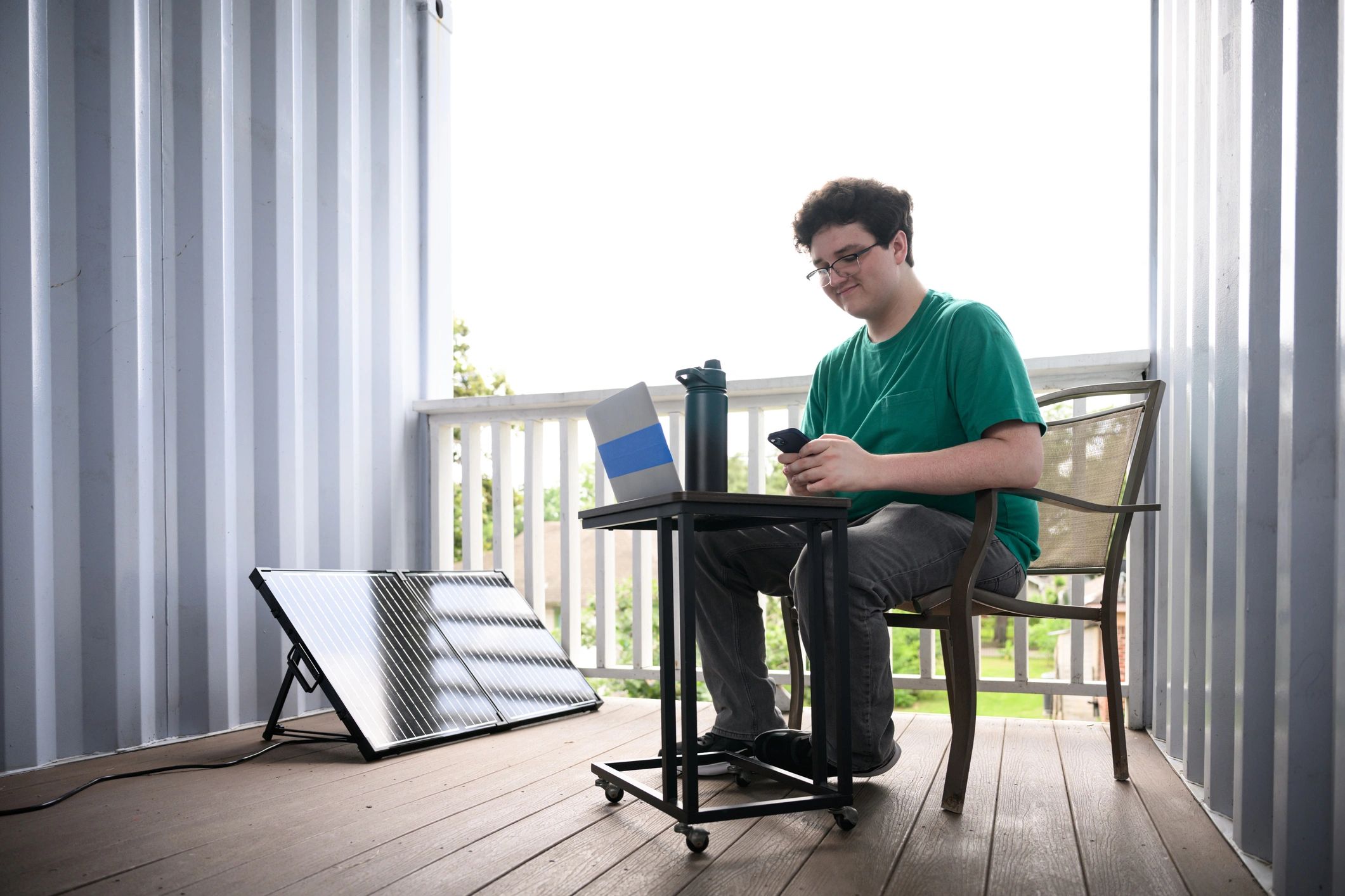 Traveler using devices outdoors while charging off grid
